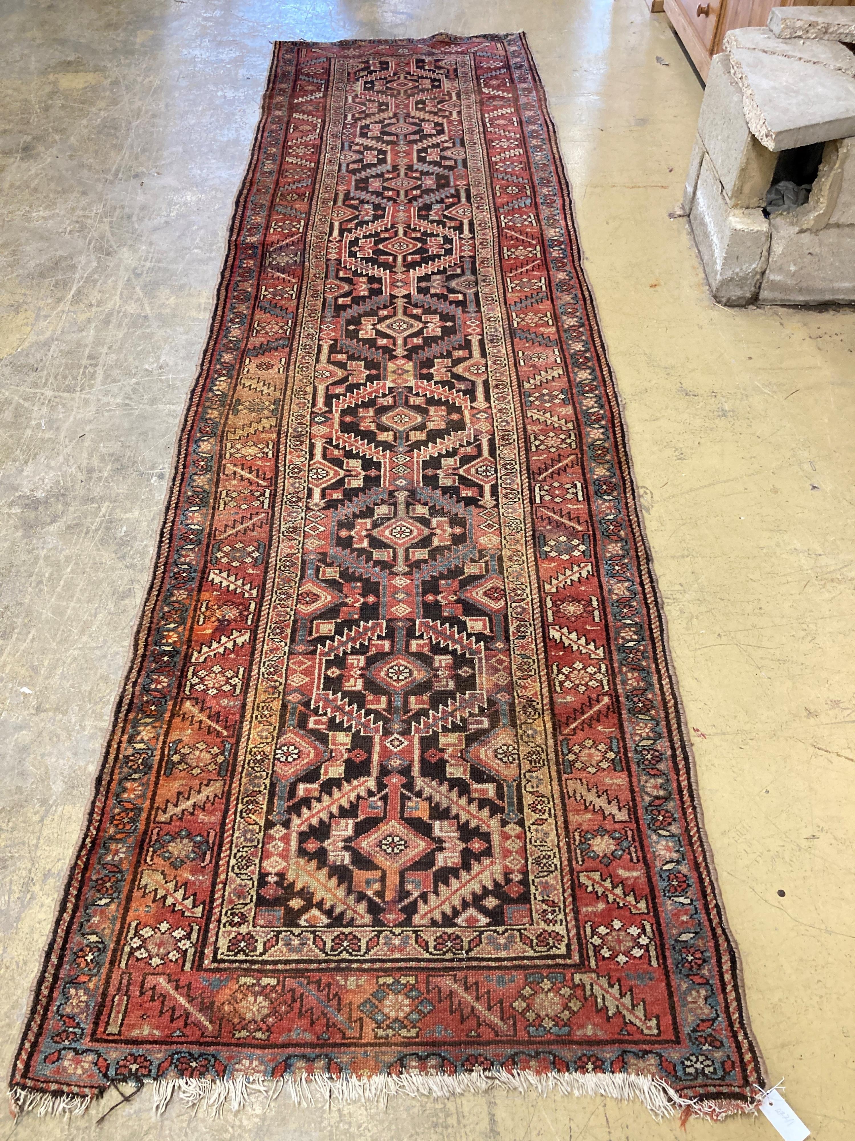 A Caucasian geometric runner, 394 x 110cm